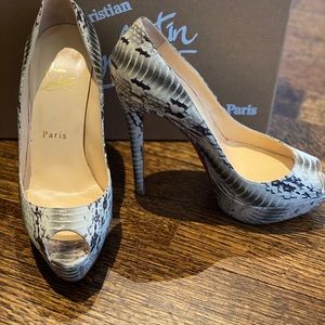 Christian Louboutin water snake peep toe shoes.